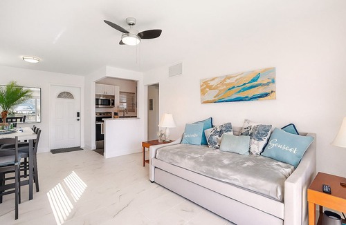 Capri Isle Condo | Treasure Island Sunset Spectacle: Waterfront Bliss, Beach Walks & Johns Pass Fun