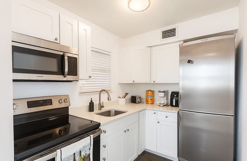 Capri Isle Condo | Treasure Island Sunset Spectacle: Waterfront Bliss, Beach Walks & Johns Pass Fun