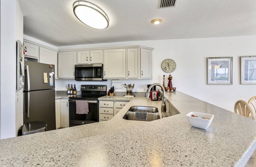 Treasure Island Condo | Water Views - Walk to Beach and Restaurants - Waterfront Pool - Low Density