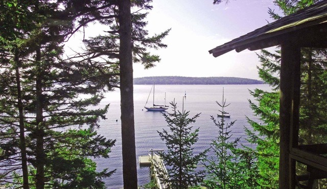 Charming 4-Bedroom Linekin Log Cabin in Boothbay, ME with stunning waterfront views.