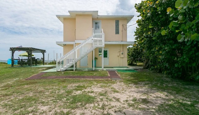 Charming Two Story House located directly on Melbourne Beach.