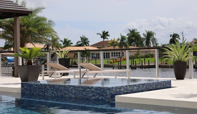 Custom Home with tile pool, boating dock and every comfort