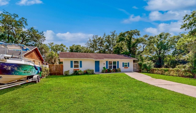 Dog-friendly home with fenced yard, firepit, washer/dryer, & central AC