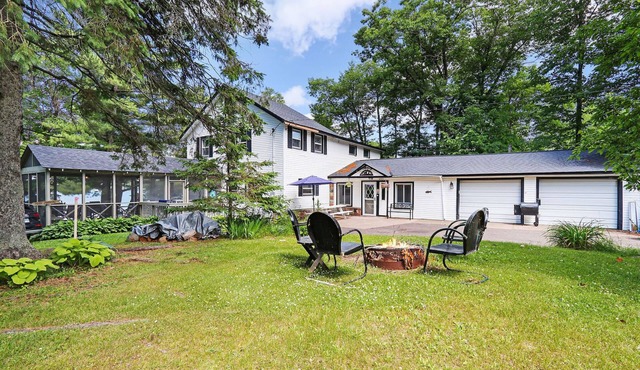 Historic Lake Front Home w/150' lake front on pristine Stone Lake walk to town