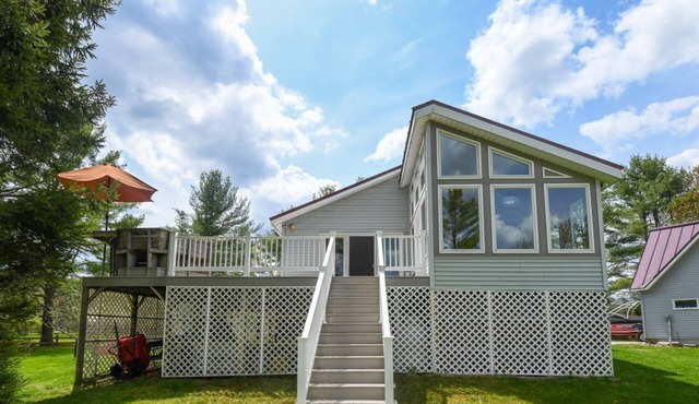 Lakeside Home with 450 feet of Private waterfront on Thompson Lake