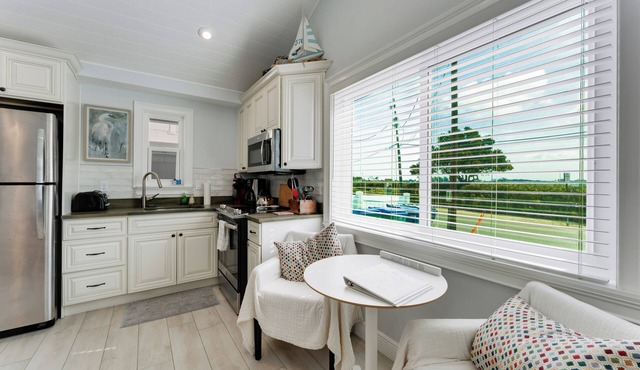 NEW LISTING. High Tide—- Beach and Bay just steps away!