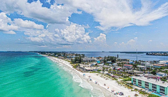 Two story condo with ocean on one side and bay on other only steps away